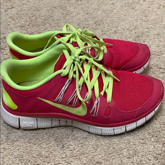 neon green and pink nike shoes